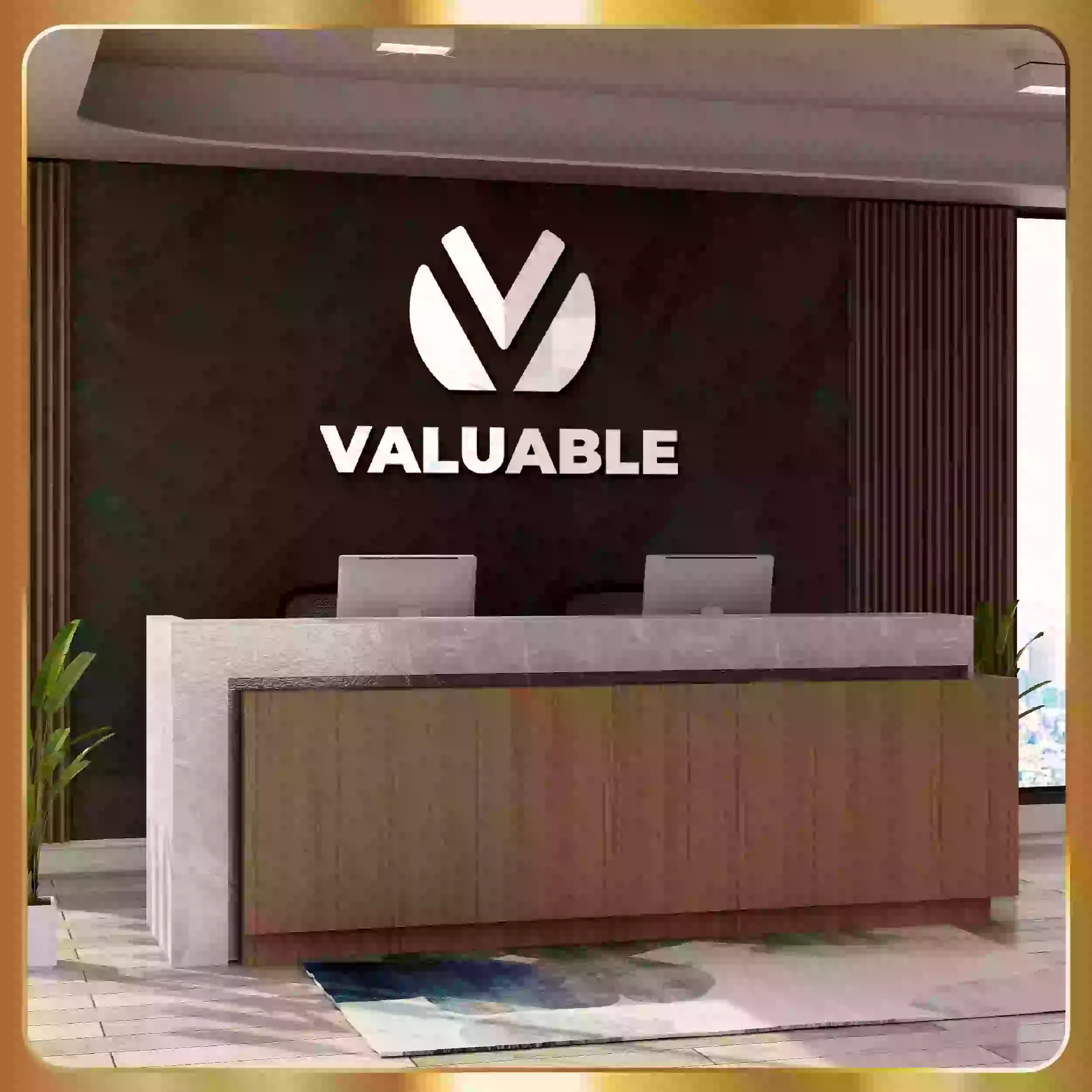 The logo for design advertising is on a desk in a room.